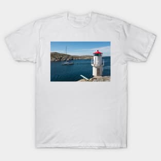 a sailboat passes the lighthouse T-Shirt